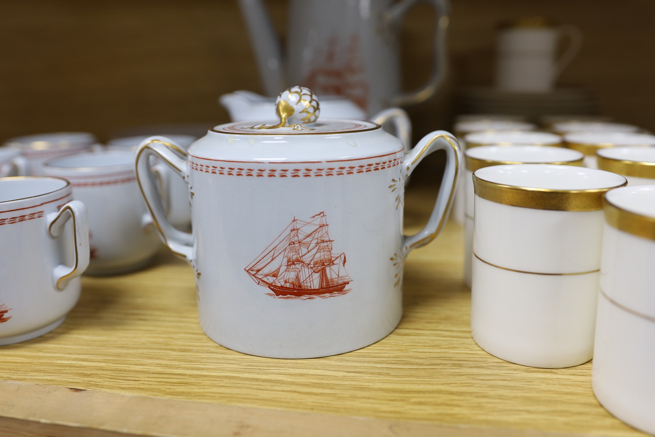 A Copeland fifteen piece coffee service, Trade Winds pattern, and a Doulton Royal Gold pattern coffee set